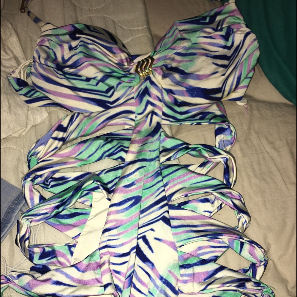 One piece babysuit . With the sides cut out